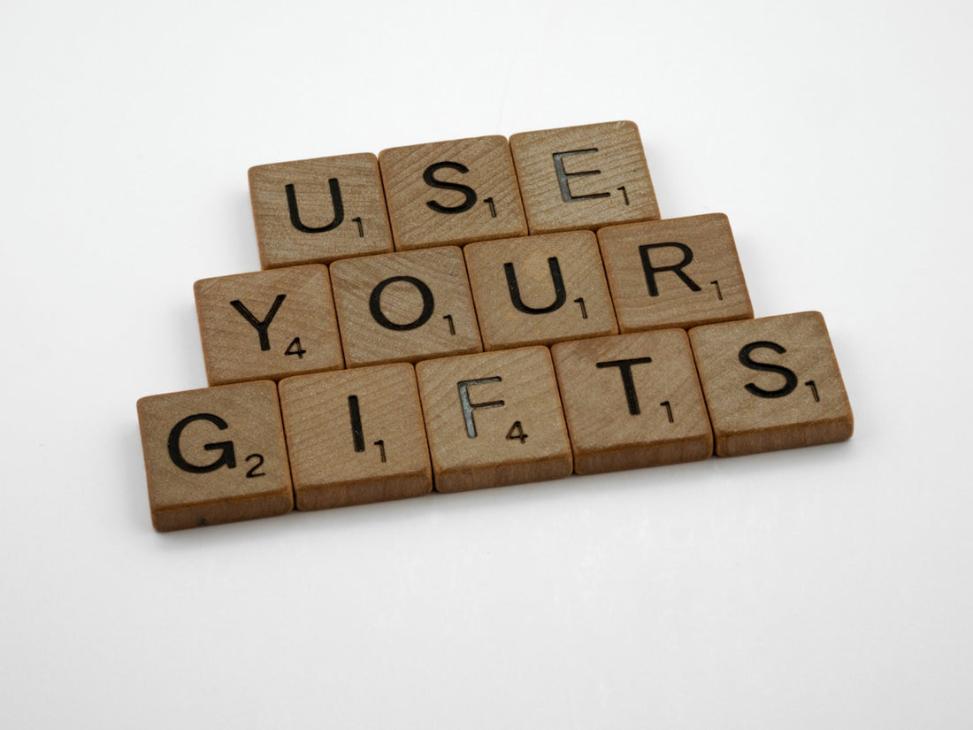 scrabbled wooden blocks spelling use your gifts