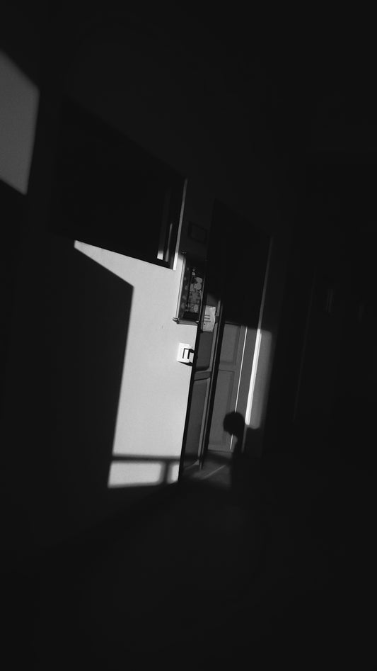 a black and white photo of a refrigerator